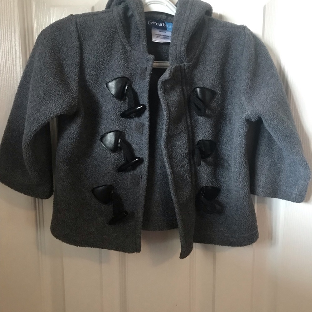 18 month unisex fleece jacket. My daughter never wore.